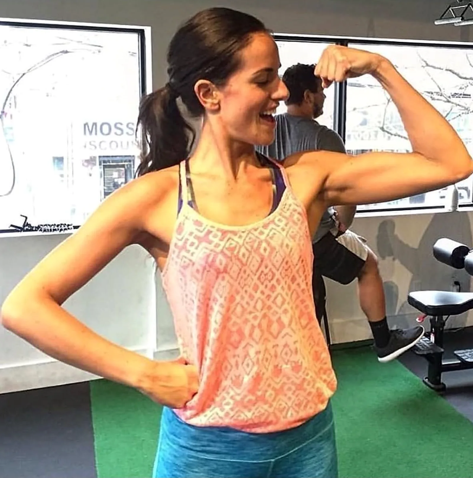 Melanie McGregor flexing at OBF Gyms